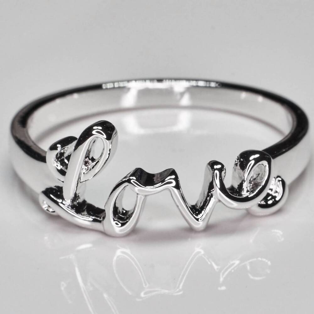 NEW FAIRE "love" rhodium plated ring in silver